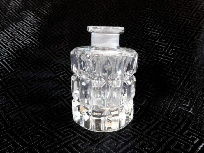 1980s round glass perfume bottle with flower shaped stopper 3963