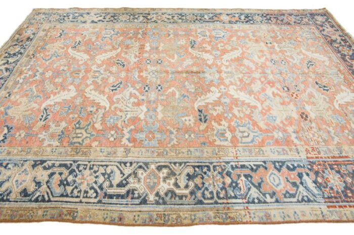 antique hand knotted persian heriz wool rug in peach with allover motif 5655