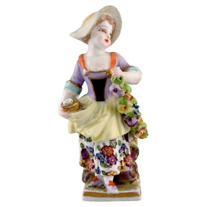 antique hand painted porcelain figure of girl with flowers from augustus rex germany 1