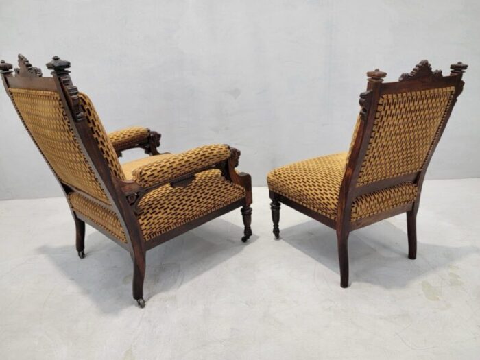 antique renaissance revival figural carved framed parlor chairs reupholstered in a patterned belgian chenille set of 2 4075