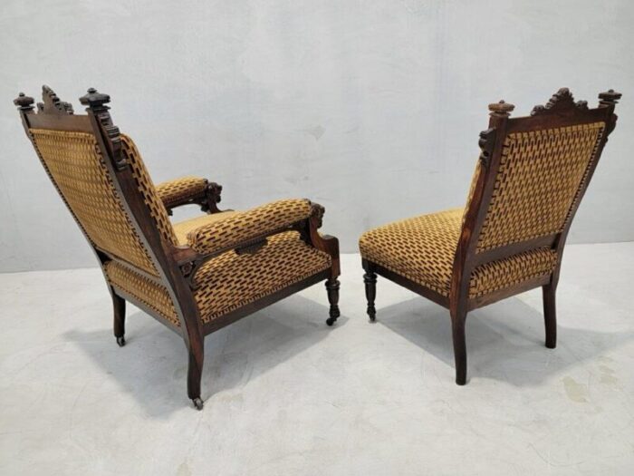 antique renaissance revival figural carved framed parlor chairs reupholstered in a patterned belgian chenille set of 2 9522