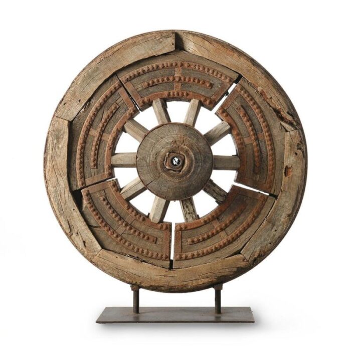 antique wooden wheel on iron foot 1