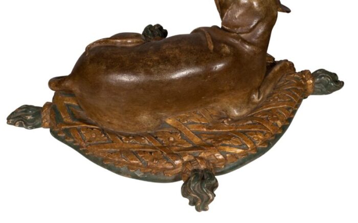 fine european carved and painted dog lying on a pillow 1080