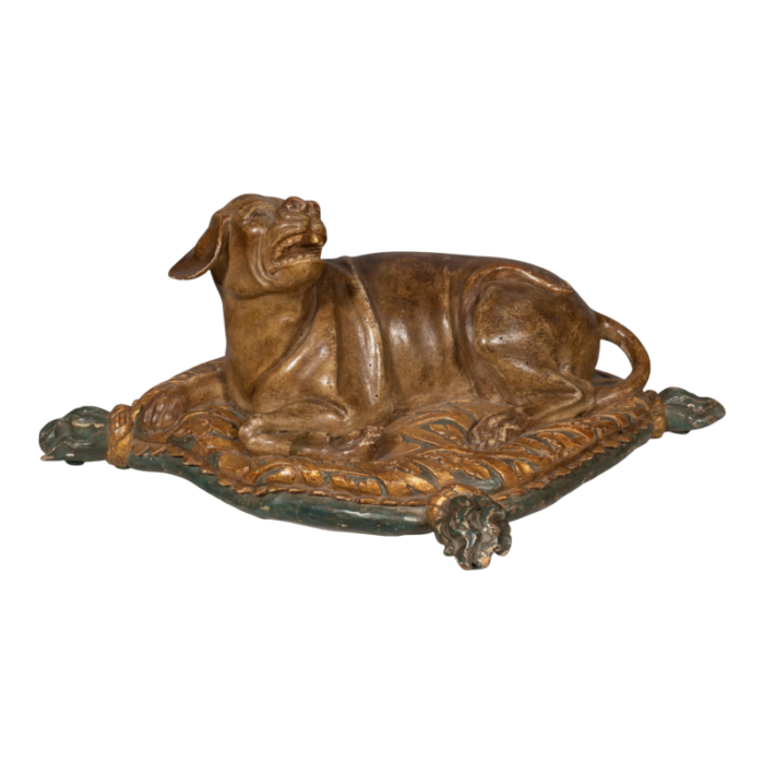 fine european carved and painted dog lying on a pillow 2949