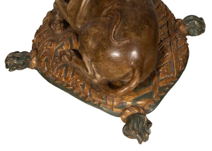 fine european carved and painted dog lying on a pillow 4142