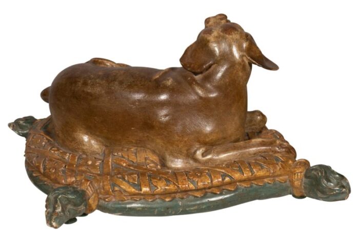 fine european carved and painted dog lying on a pillow 4838