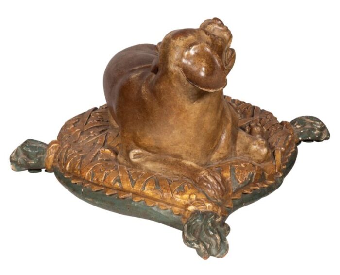 fine european carved and painted dog lying on a pillow 6619