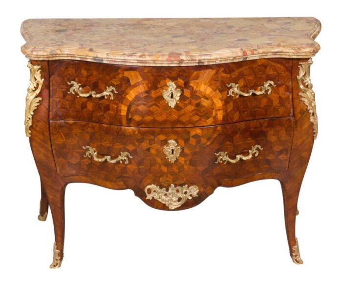 louis xv tulipwood and parquetry commode 1667