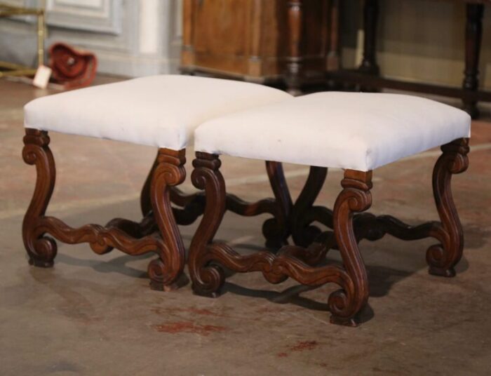 pair of 19th century french louis xiii carved walnut stools with white muslin 4155