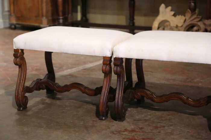 pair of 19th century french louis xiii carved walnut stools with white muslin 9204