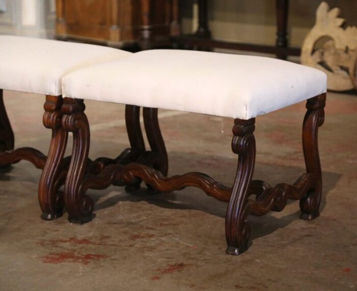 pair of 19th century french louis xiii carved walnut stools with white muslin 9341