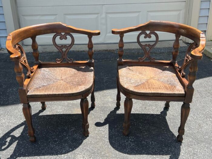 pair of vintage mid 20th century rush seat corner chairs with tasseled red cushions 0406