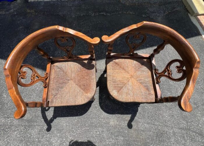 pair of vintage mid 20th century rush seat corner chairs with tasseled red cushions 1518