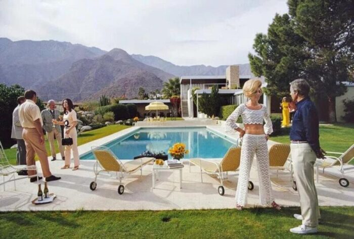 slim aarons poolside conversation estate stamped photographic print 1970 2020s 8230