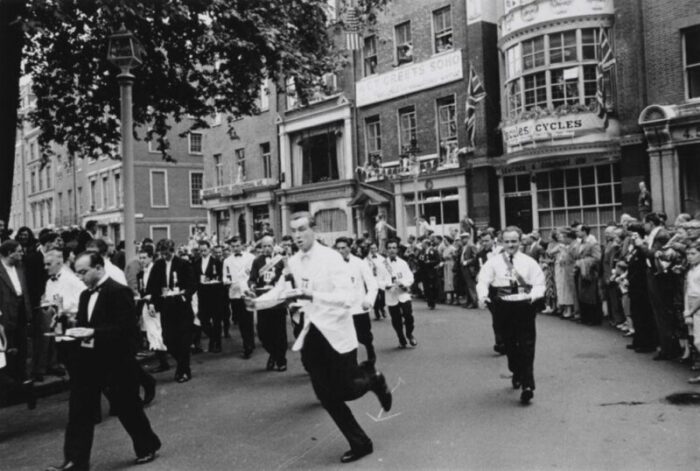 slim aarons soho waiters race 1955 silver gelatin fibre print 7596