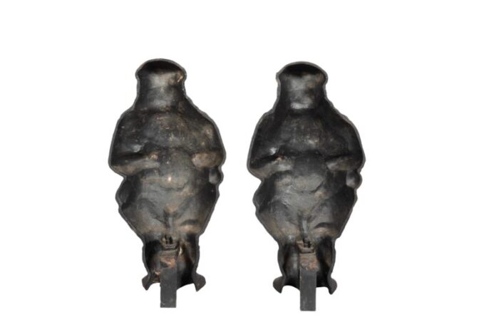 st nicholas cast iron andirons a pair 0438