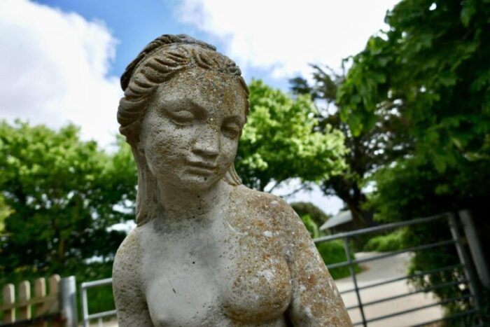 statue of the goddess tyche holding a snake 1920s 5