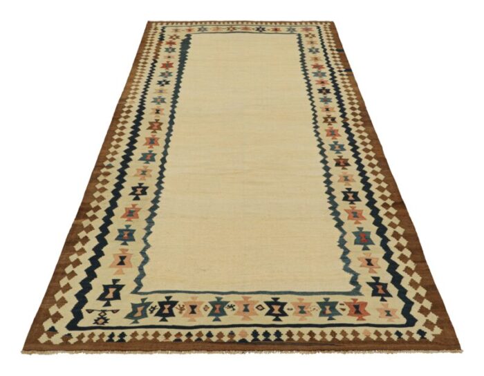 vintage kilim with beige open field and geometric borders from rug and kilim 8236