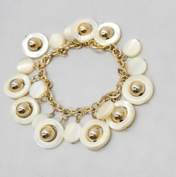 vintage signed napier goldtone mother of pearl charm bracelet 5078