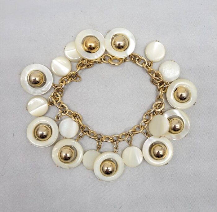 vintage signed napier goldtone mother of pearl charm bracelet 6799