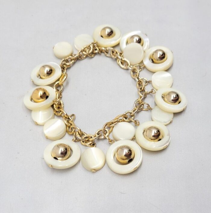 vintage signed napier goldtone mother of pearl charm bracelet 6810